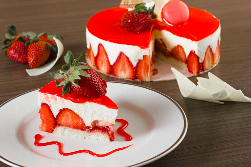 Slice of a delicious strawberry cheesecake.