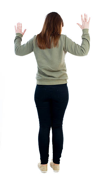 istock back view of woman  protects hands from what is falling 506250596