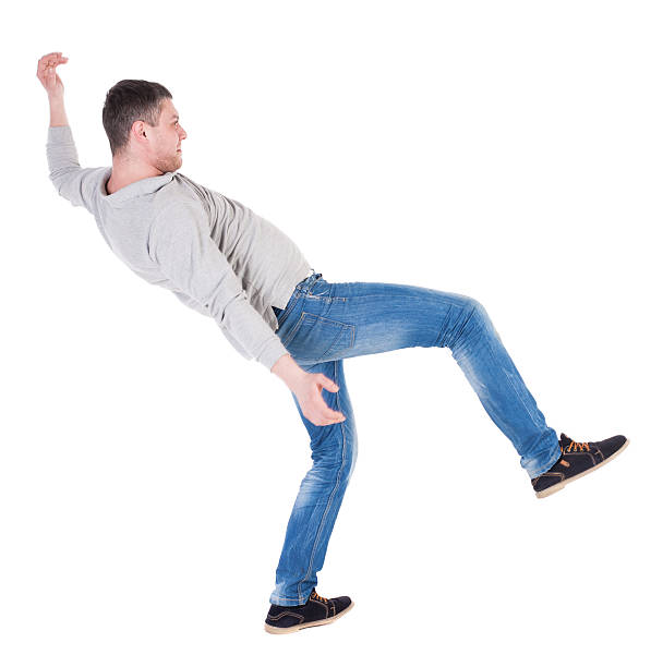 istock Back view man Balances waving his arms. 506251352