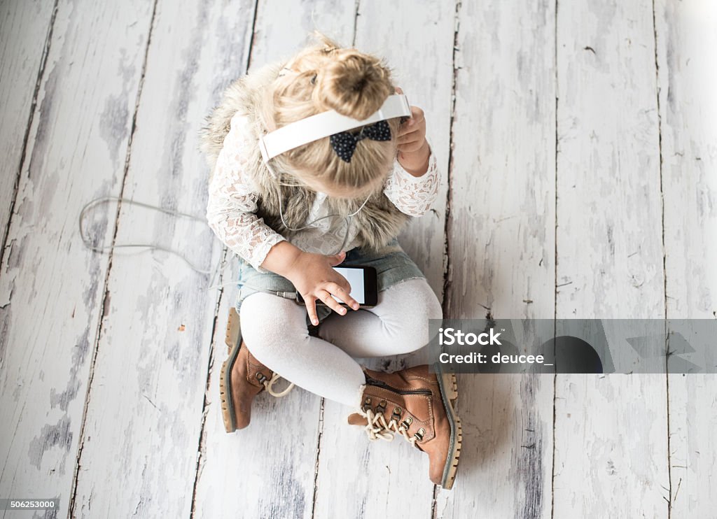 Little girl with headphones 2-3 Years Stock Photo