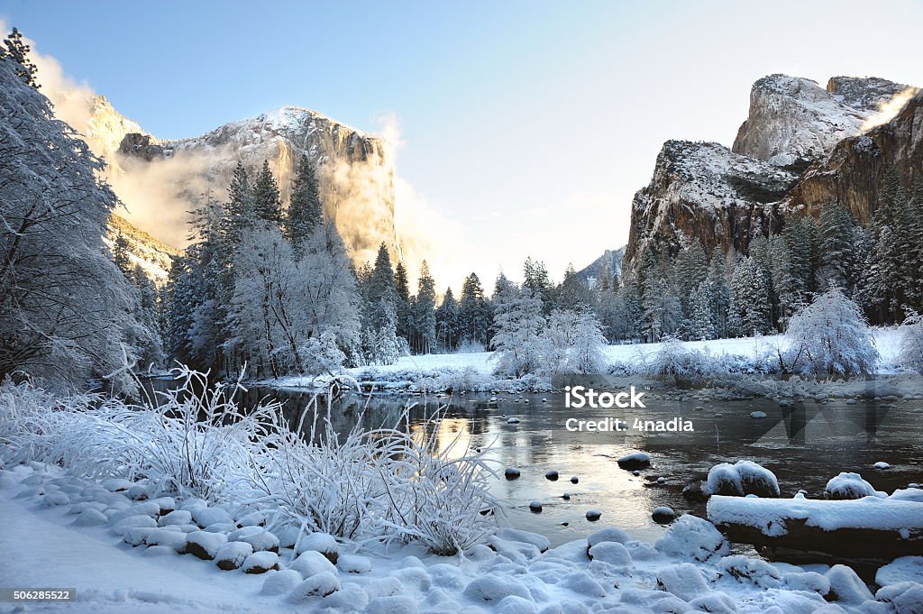 Yosemite Valley After a Fresh Snow The Merced River in a snow covered Yosemite Valley. Mountain Stock Photo