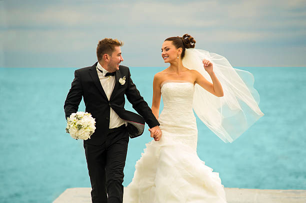 istock The newlyweds are piddling on the pier. 506285612