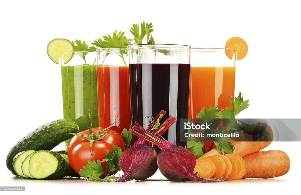 Glasses with fresh vegetable juices isolated on white Glasses with fresh vegetable juices isolated on white. Detox diet. Antioxidant Stock Photo