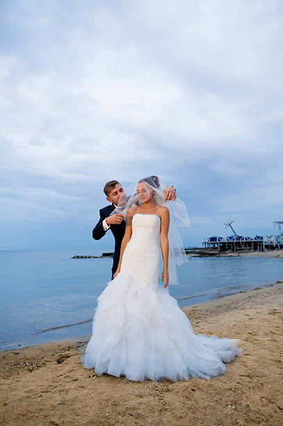 istock Beautiful newlyweds by the seashore. 506286126