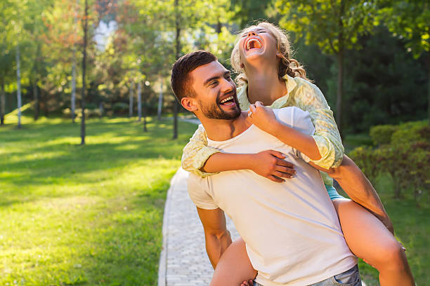 istock Guy and a girl having fun in the park. 506286494