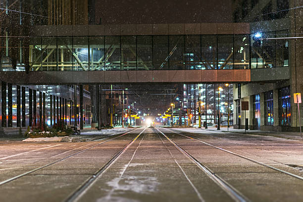 istock Snow Falling on Train Tracks on in Winter in Minneapolis 506286990
