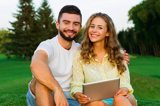istock In love couple relaxing in the park. 506287626