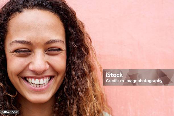 Cheerful Young Woman Laughing Stock Photo - Download Image Now - Close-up, Smiling, Women