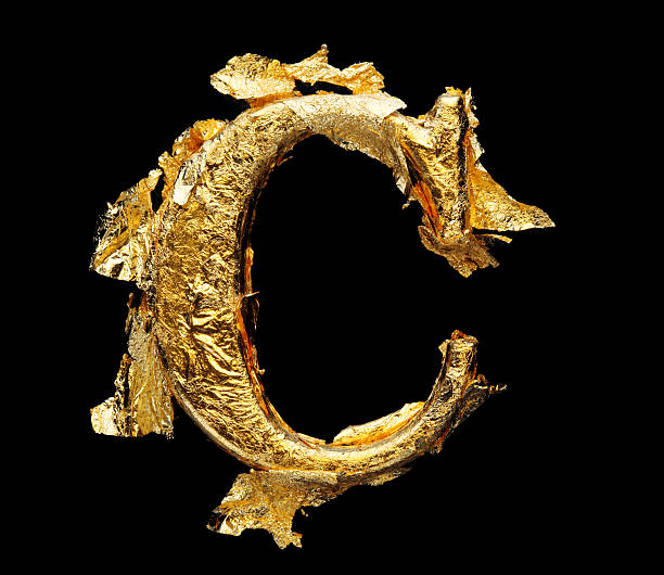 istock Alphabet and numbers in rough gold leaf 506288286