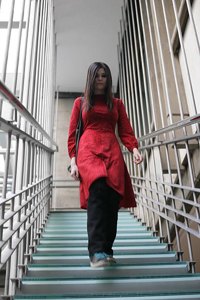istock Young woman walking down the stairs. 506288440