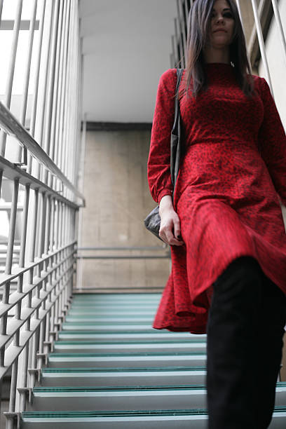 istock Woman going down the stairs 506288466