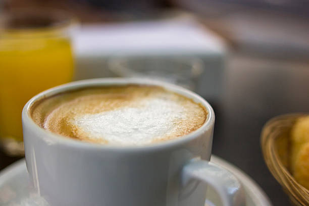 istock Creamy cappuccino with orange juice 506288828
