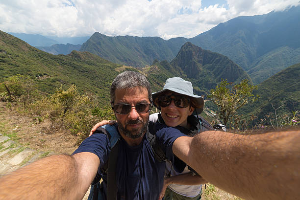 istock Couple taking selfie at Machu Picchu, Peru 506289902