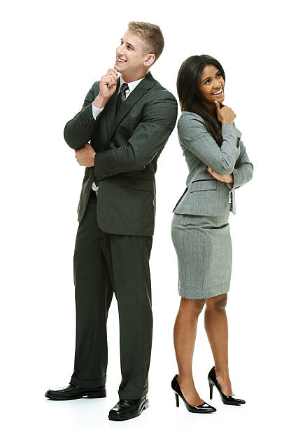 istock Smiling business couple standing and looking away 506290198
