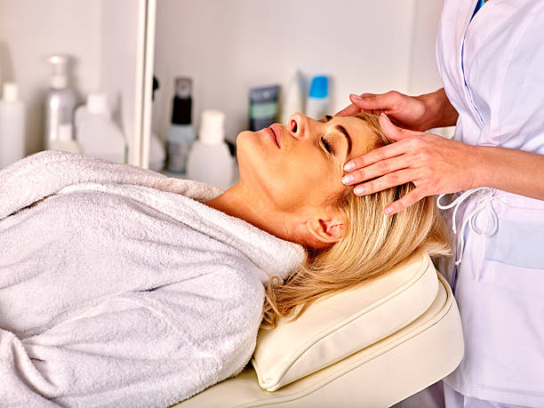 istock Woman middle-aged take face massage in spa salon 506291784
