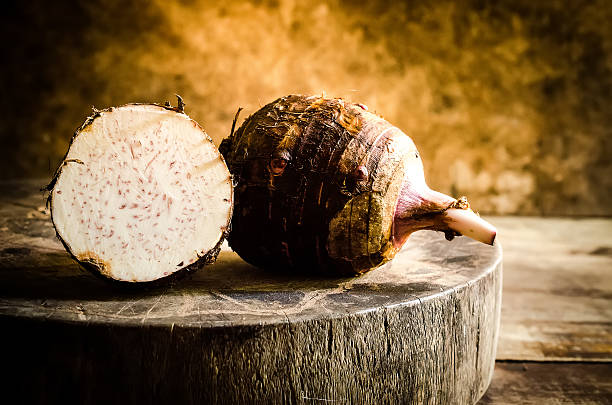istock Taro placed on the chopping block in vintage style. 506292358
