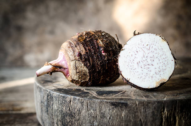 istock Taro placed on the chopping block in vintage style. 506292456