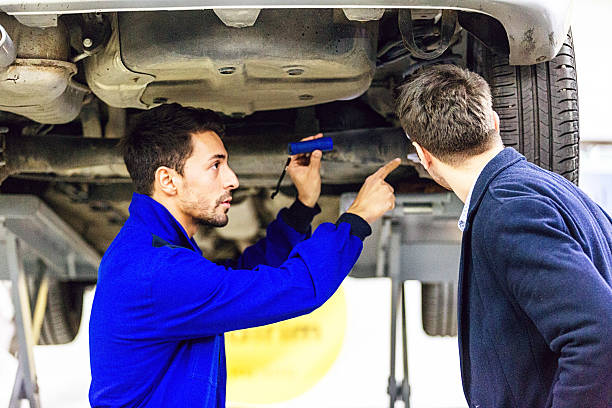 istock Auto Mechanic Talking With Car Owner 506292800