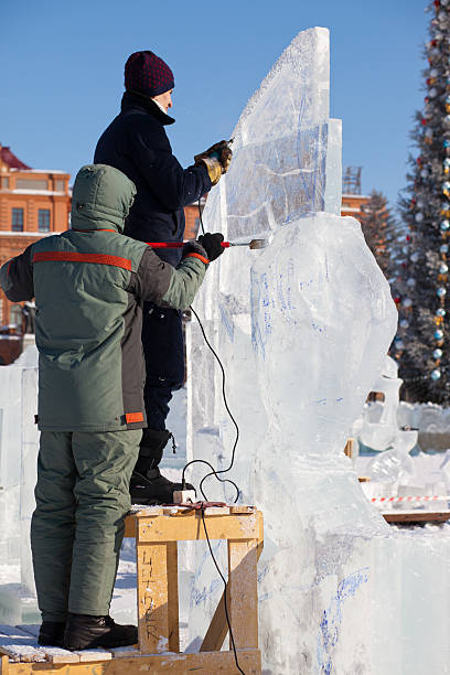 chabarowsk, russland - 23. januar 2016: ice sculpture wettbewerb - ice carving sculpture chisel stock-fotos und bilder