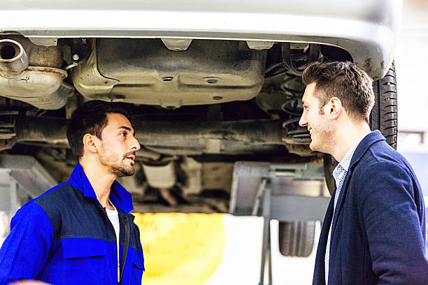 istock Auto Mechanic Talking With Car Owner 506293830