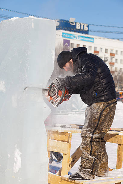 chabarowsk, russland - 23. januar 2016: ice sculpture wettbewerb - ice carving sculpture chisel stock-fotos und bilder