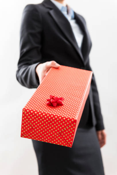 istock Businesswoman holding gift box 506293954