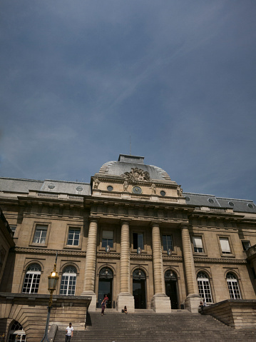 Paris, France - 25 June, 2015: Facade of the Palais de Justice, formerly the Palais de le Cite,  on the Boulevard du Palais in the Île de la Cité in central Paris.