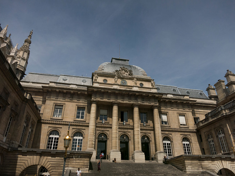 Paris, France - June 25, 2015: Facade of the Palais du Justice Paris.  One of the oldest surviving buildings of the former Royal Palace, former headquarters of The Republic.
