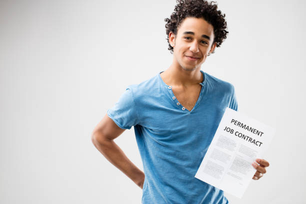 istock permanent job contract shown by a young man 506294592