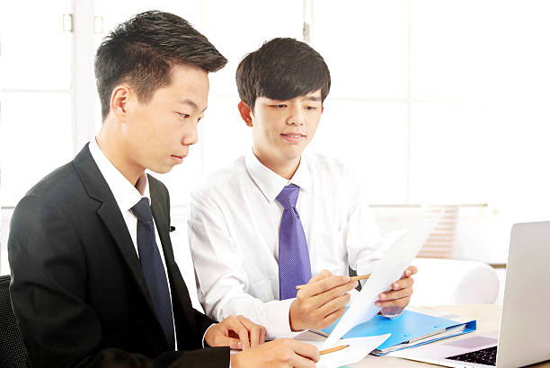 istock Young employees in the office to discuss 506295054