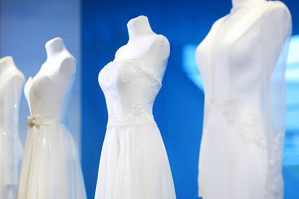 Wedding dresses on a mannequins Beautiful wedding dresses on a mannequins red evening gown mannequin indoors stock pictures, royalty-free photos & images