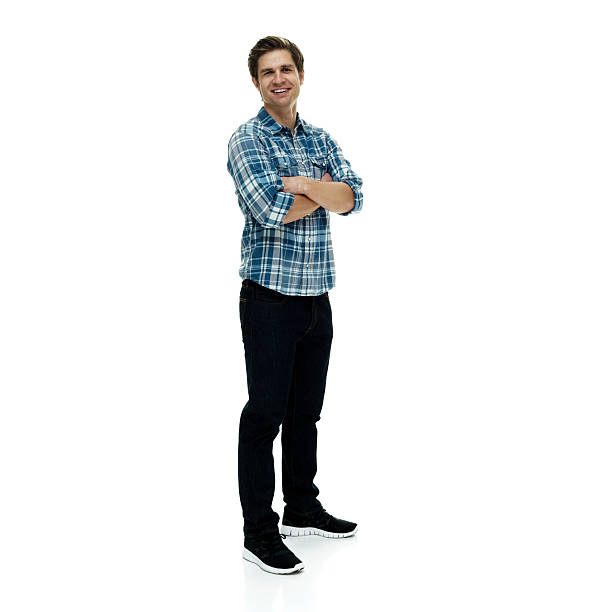 istock Smiling casual man standing with arms crossed 506296736