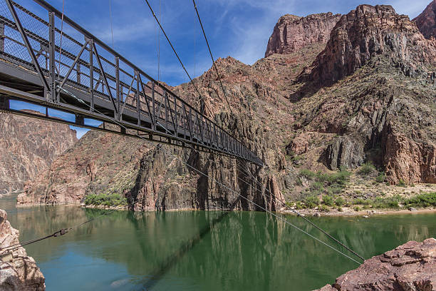Black Bridge Over The Colorado River In The  Grand Canyon The Black Bridge at the bottom of the Grand Canyon in Arizona which spans across the Colorado River. It is along the South Kaibab Trail. Nearby is the Phantom Ranch. south kaibab trail stock pictures, royalty-free photos & images