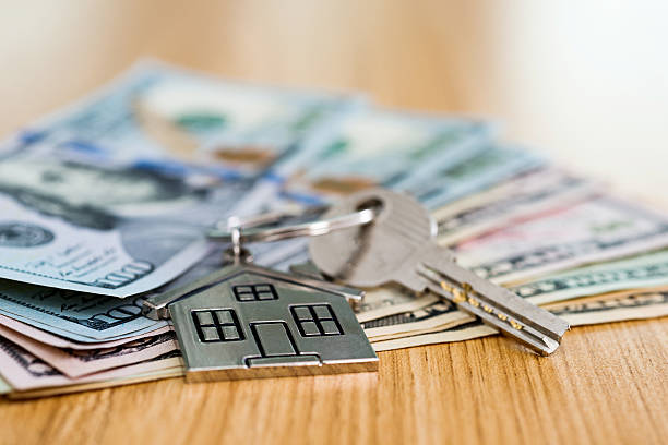 istock House key on money 506300740