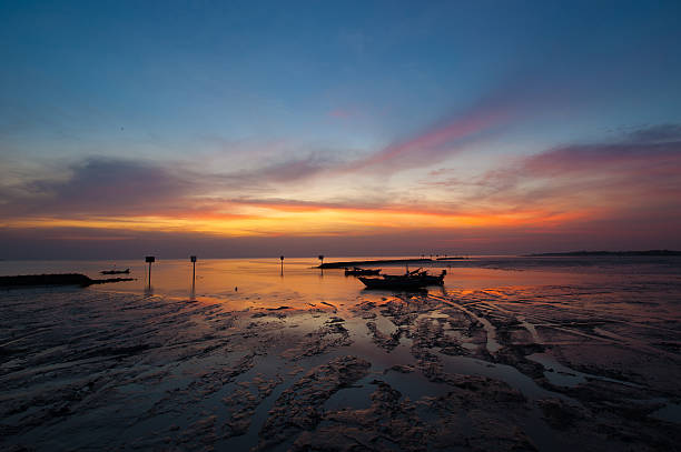 istock Long exposure technique of long tail boat at dusk. 506313666
