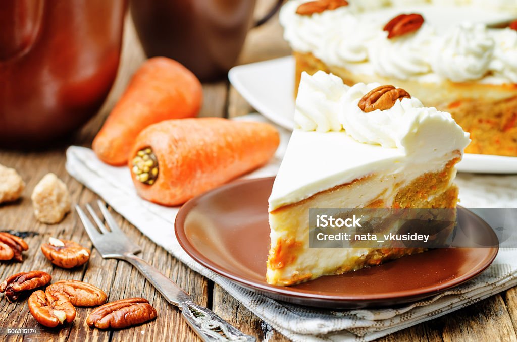 carrot cake cheesecake with pecan carrot cake cheesecake with pecan on a dark wood background. toning. selective Focus Baking Stock Photo