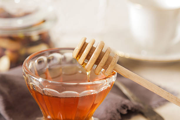 istock Fresh delicious honey in a crystal glass 506315682