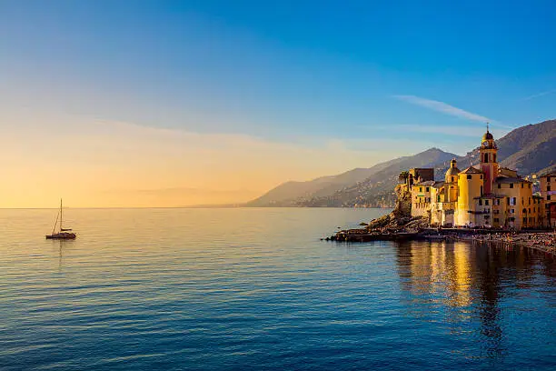 Mediterranean Sea at sunrise, small old town and yacht - Europe, Italy, Camogli
