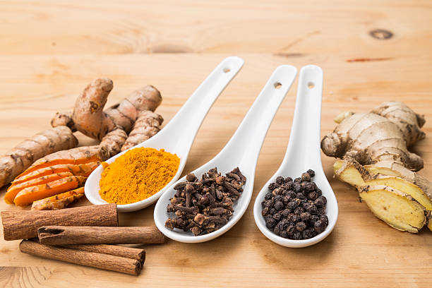 istock Ingredients for turmeric tea consisting ginger, cinnamon, cloves 506317338