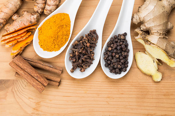 istock Ingredients for turmeric tea consisting ginger, cinnamon, cloves 506317384