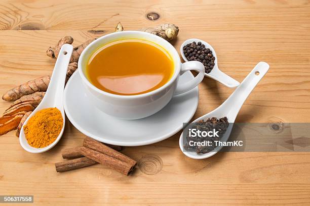 Healthy Turmeric Tea With Black Pepper Cinnamon Cloves And Gin Stock Photo - Download Image Now