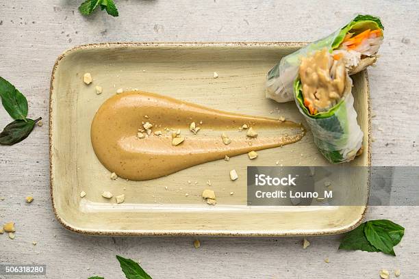 Peanut Butter Sauce And Spring Rolls Top View Stock Photo - Download Image Now - Peanut Butter, Spring Roll, Appetizer