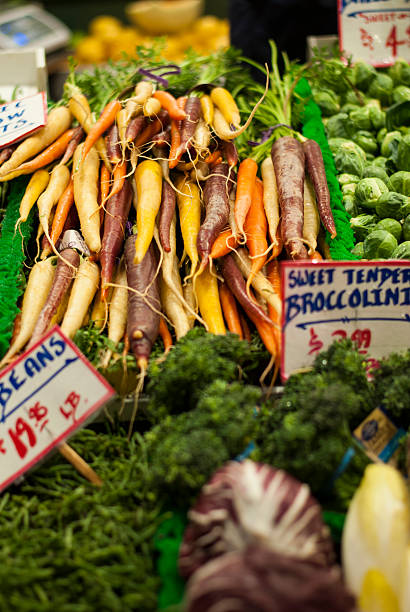 istock Rainbow Carrots on a market stand 506318798