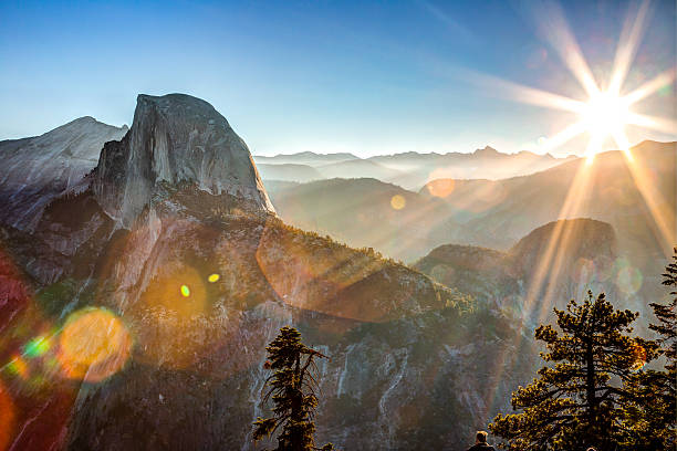 Sun Rising on Half Dome Yosemite National Park, California mariposa county stock pictures, royalty-free photos & images