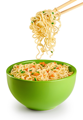 Bowl of instant noodles isolated on white background. Chopsticks.