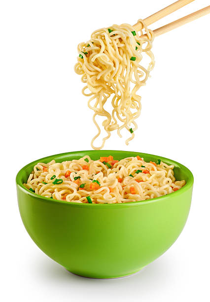 Bowl of instant noodles isolated on white background. Bowl of instant noodles isolated on white background. Chopsticks. chopsticks photos stock pictures, royalty-free photos & images