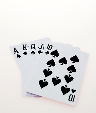 Poker royal flush suit of spades, isolated on white background.