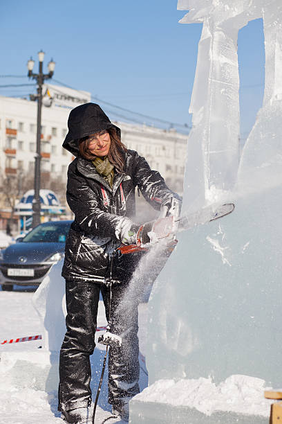 chabarowsk, russland - 23. januar 2016: ice sculpture wettbewerb - ice carving sculpture chisel stock-fotos und bilder