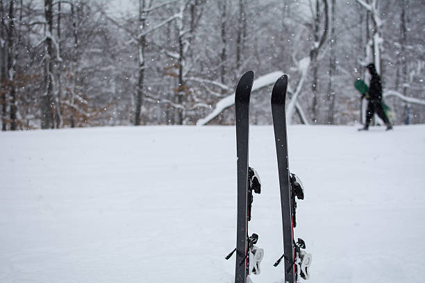 istock Ski in the snow. Skier is passing with his snowboard 506325476