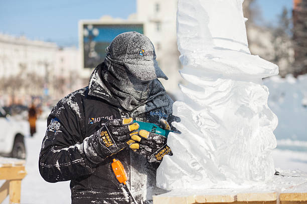 chabarowsk, russland - 23. januar 2016: ice sculpture wettbewerb - ice carving sculpture chisel stock-fotos und bilder